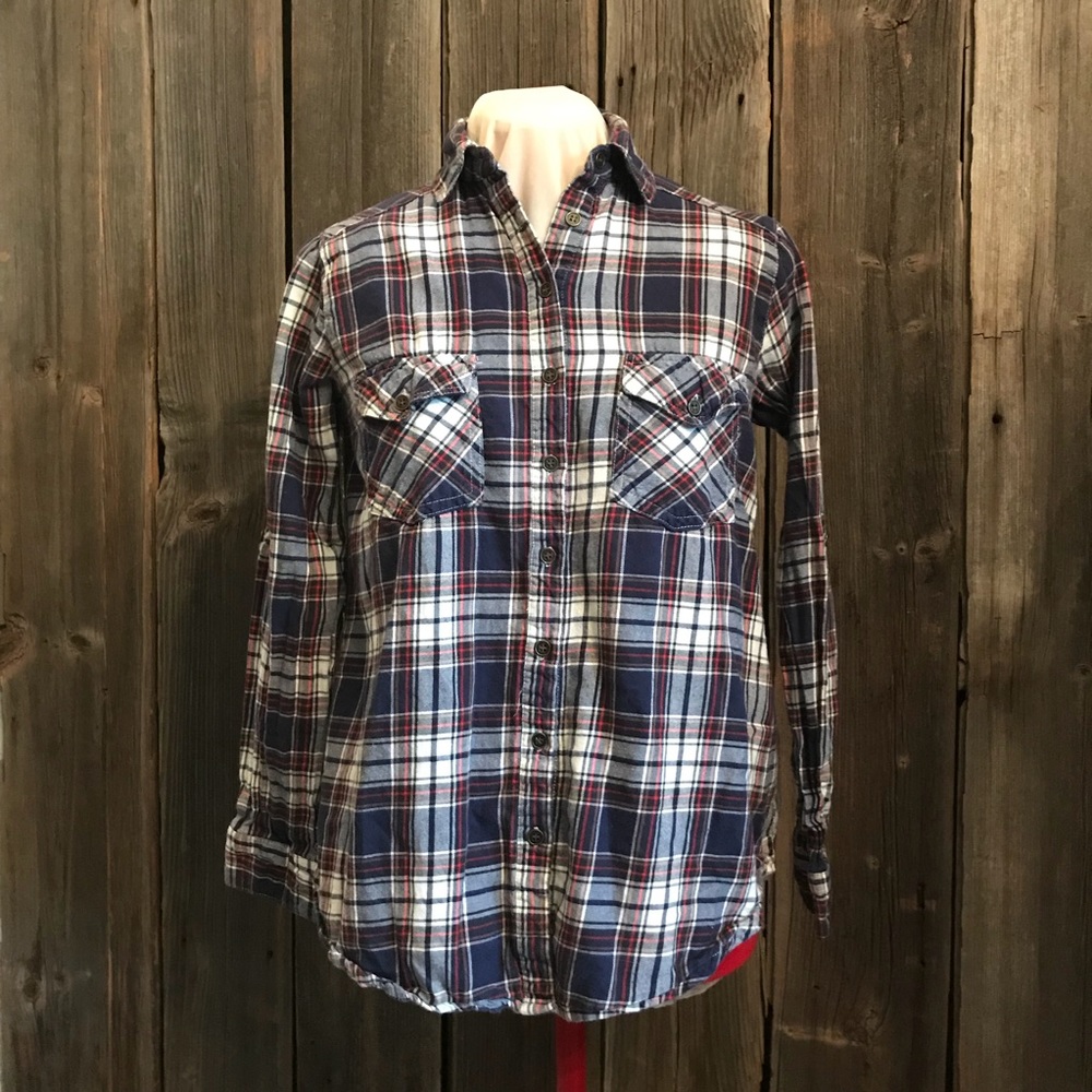 Plaid button down long sleeved shirt.